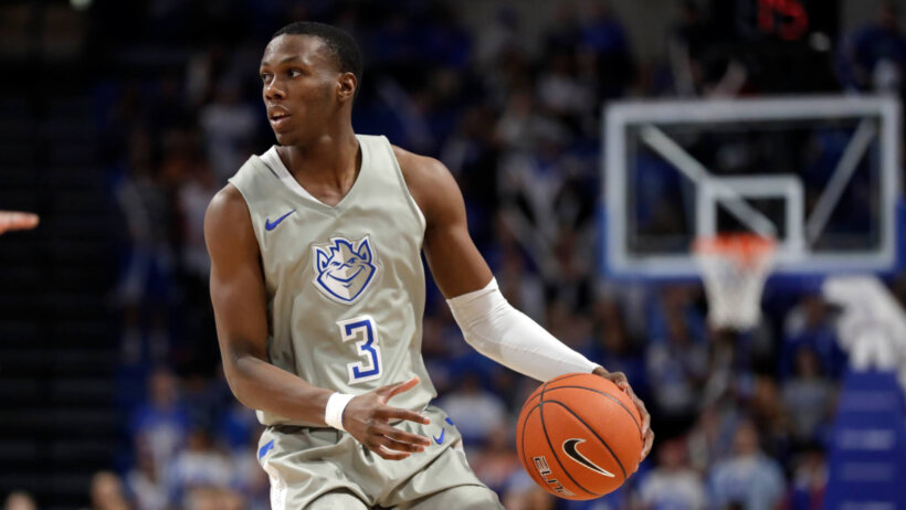 Saint Louis Billikens' Javonte Perkins dribbling the ball down the court during a game.