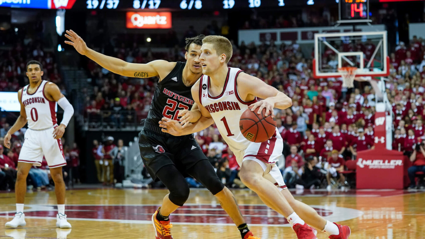 Brevin Pritzl driving past defender