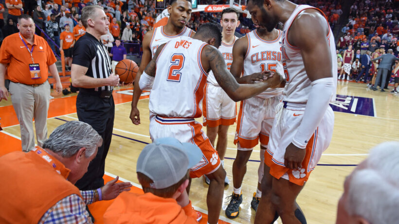 Clemson's Al-Amir Dawes is helped up by teammates