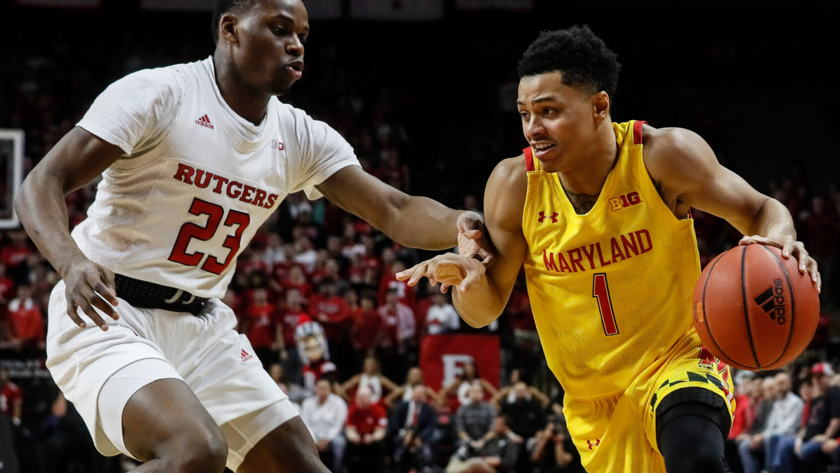 Maryland's Anthony Cowan Jr. drives against Rutgers' Montez Mathis during a game.