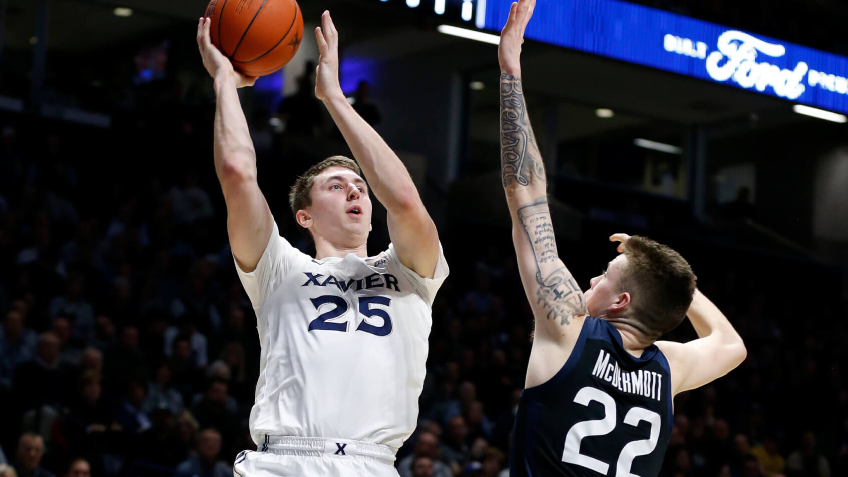 Xavier forward Jason Carter going up for a shot over Butler forward Sean McDermott.
