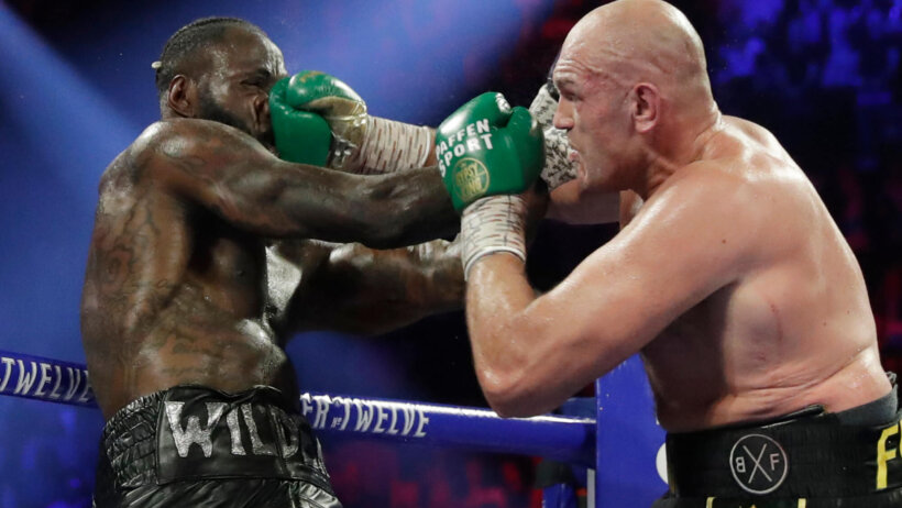 Tyson Fury landing a punch on Deontay Wilder