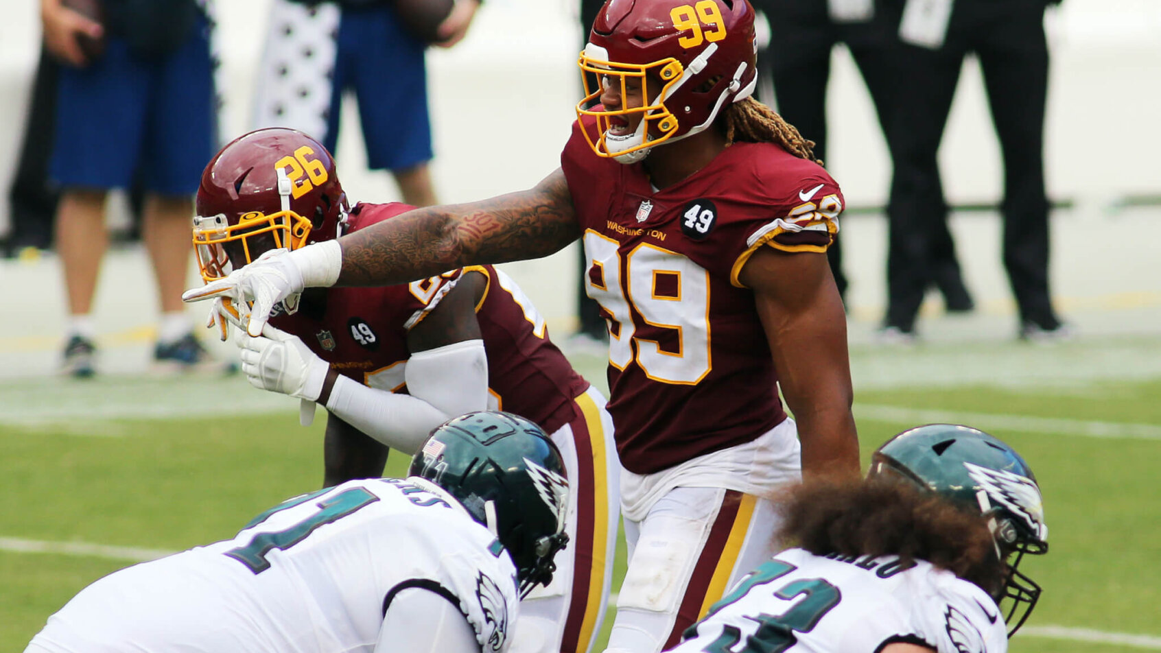 Washington Football Team defensive end Chase Young on the field during a game.