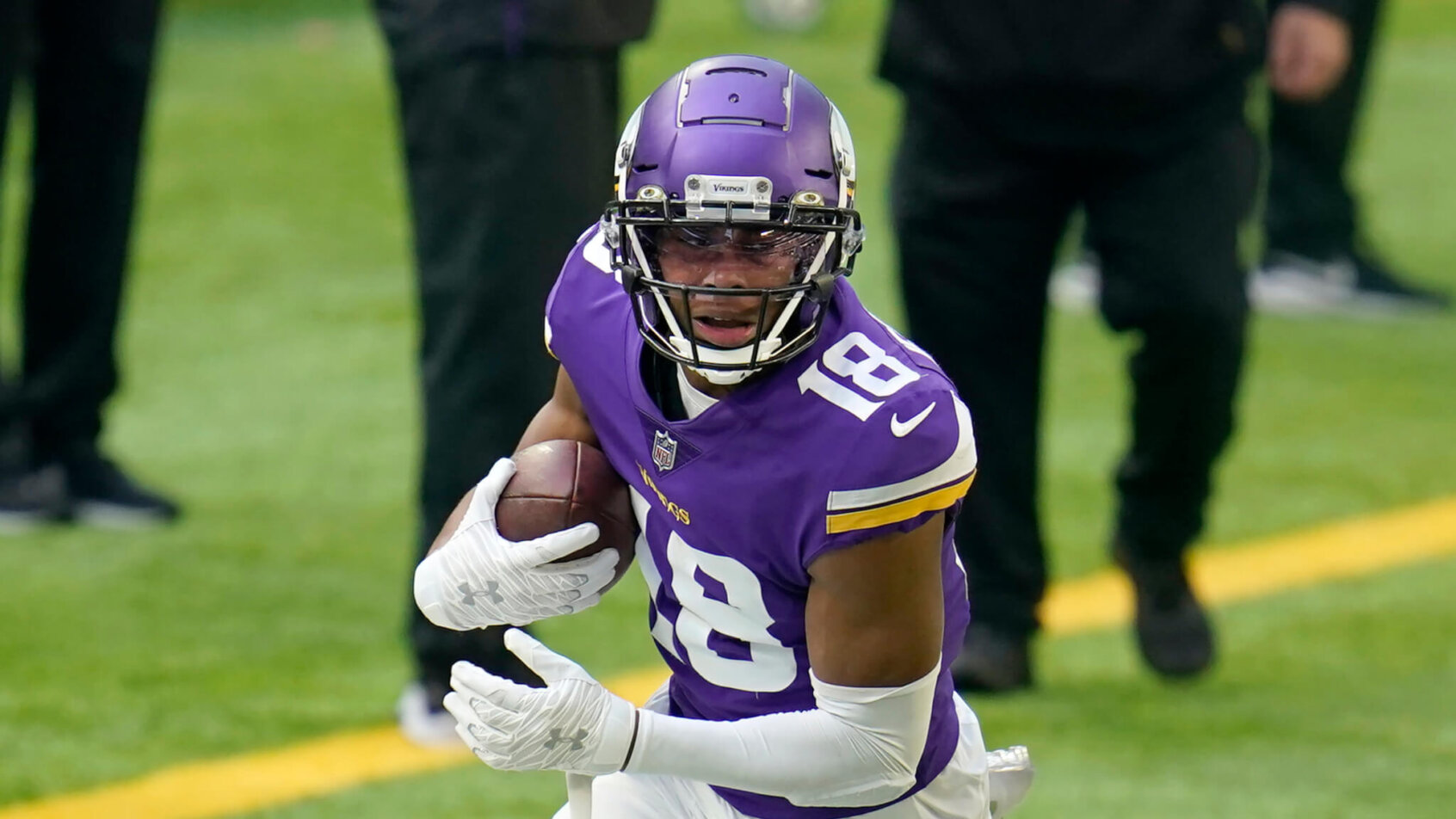 Justin Jefferson of the Vikings turns up field