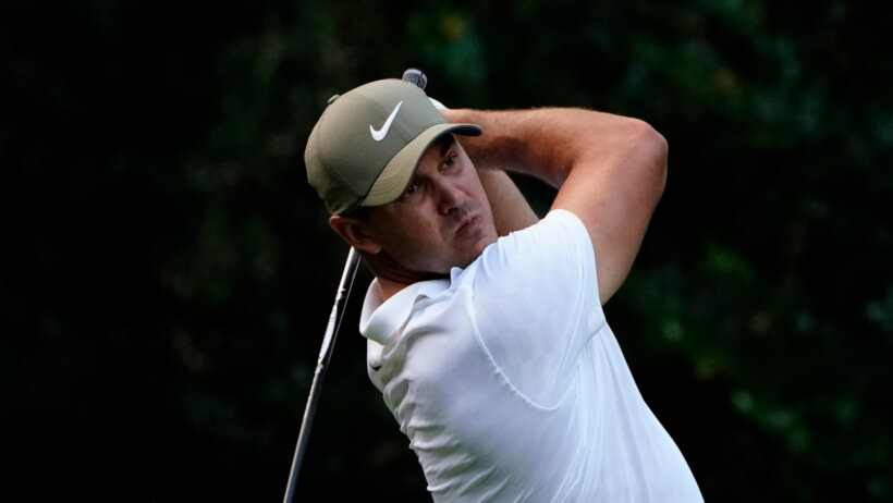Brooks Koepka watching ball after swing