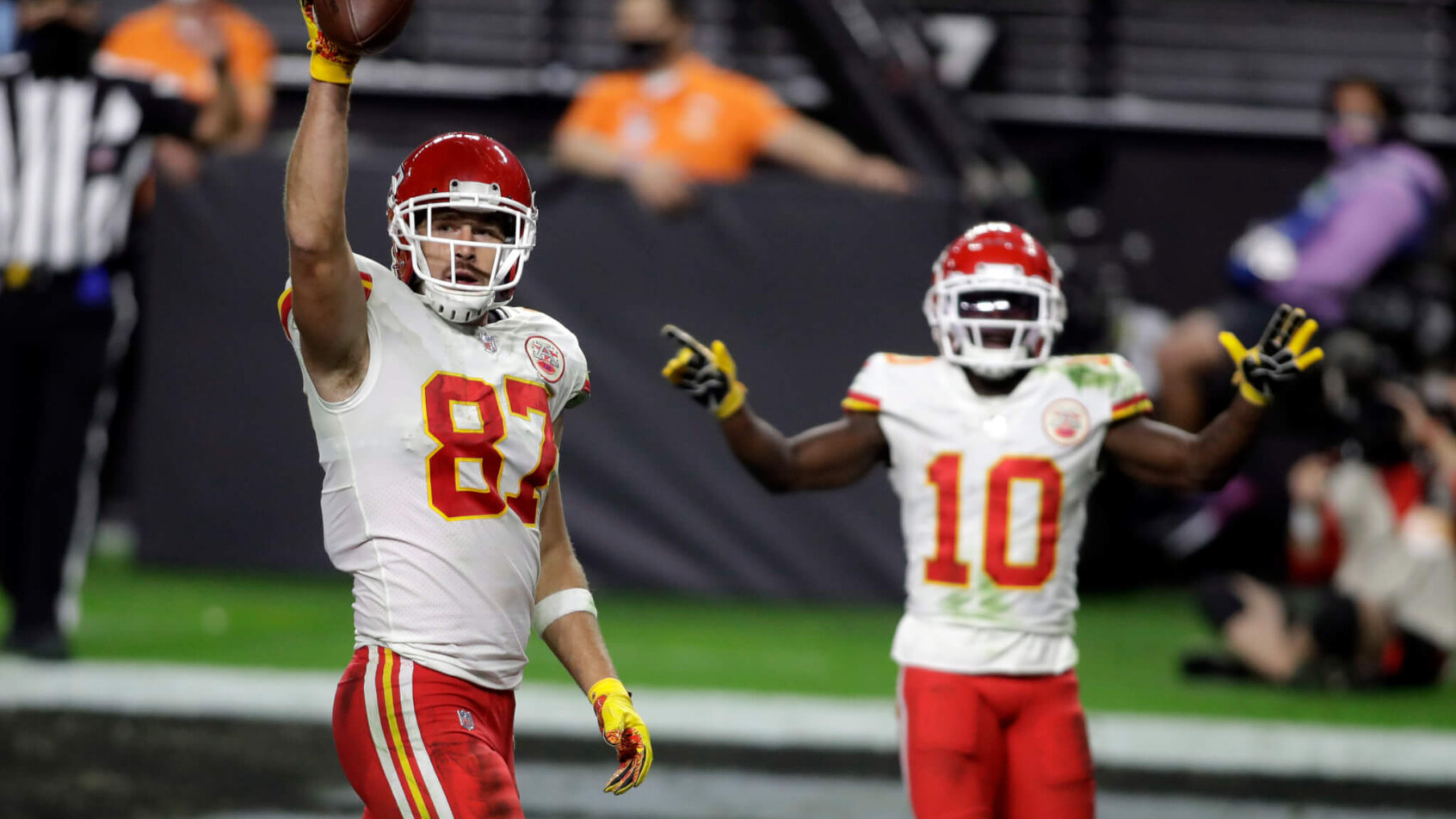 Kansas City Chiefs Travis Kelce (87) and Tyreek Hill (10) celebrating after a touchdown.