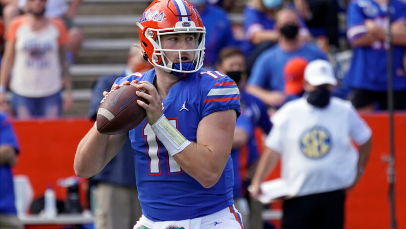 Kyle Trask throwing