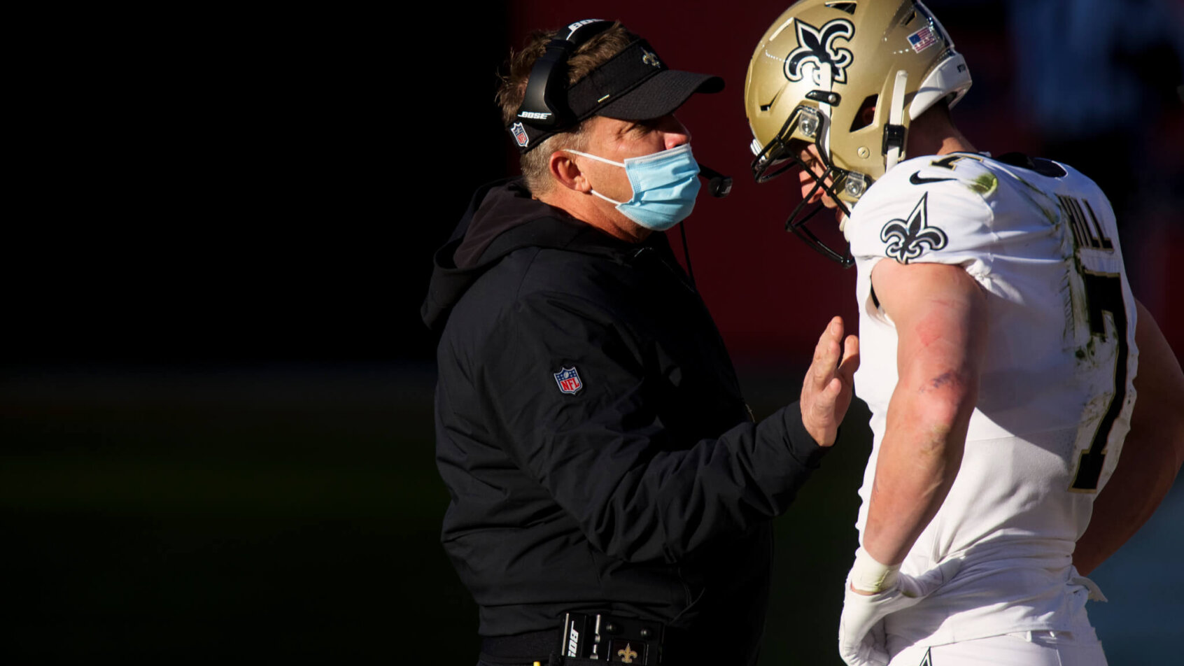 Saints head coach Sean Payton speaking to quarterback Taysom Hill
