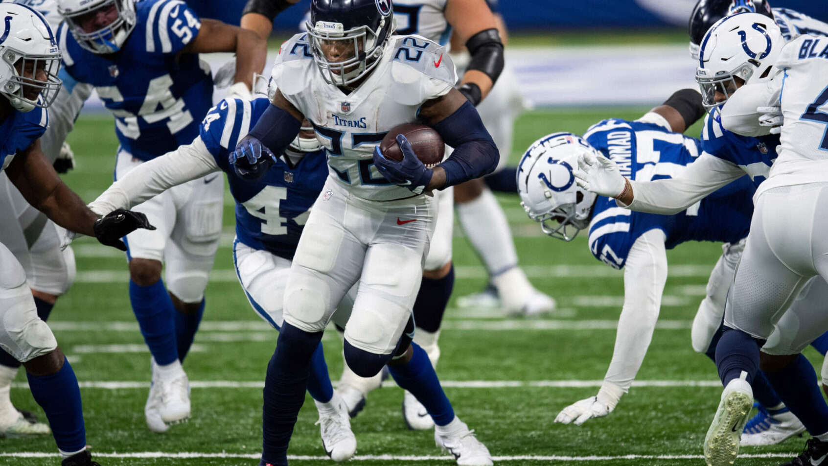 Tennessee Titans running back Derrick Henry running with the ball during a game.