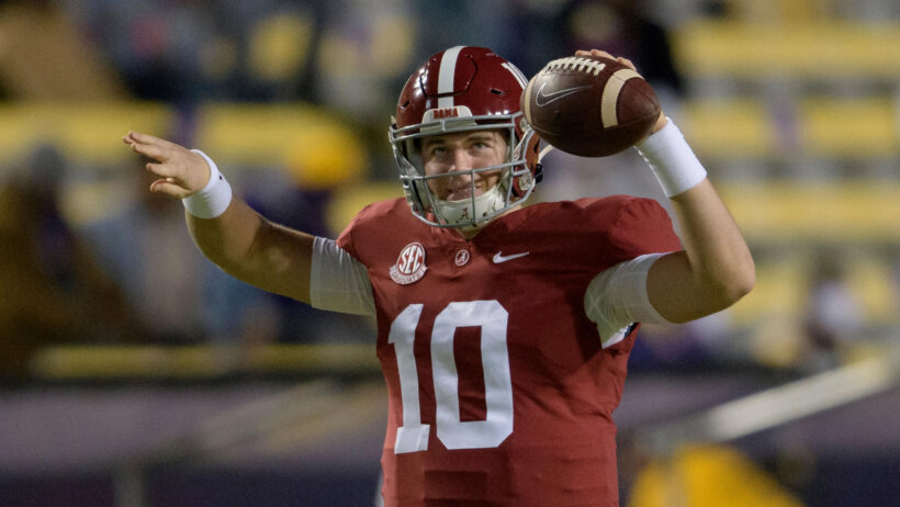 Alabama quarterback Mac Jones warming up