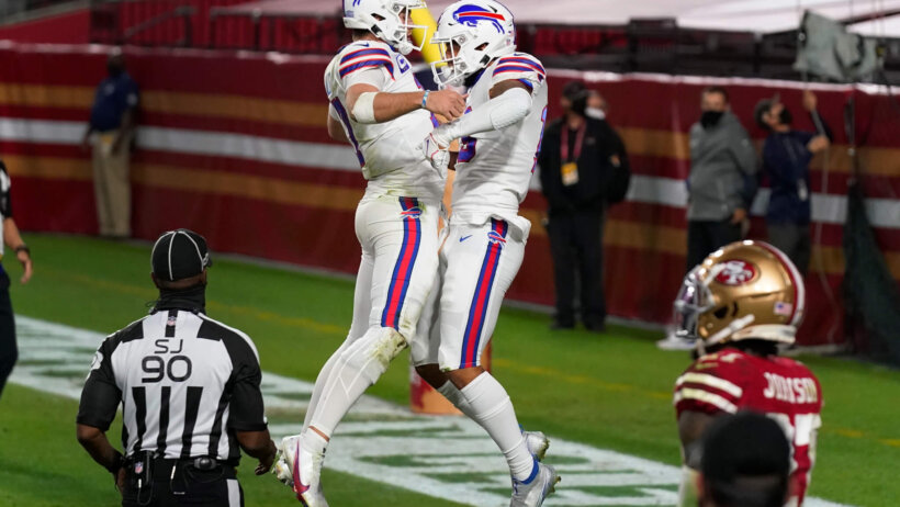 Josh Allen and Gabriel Davis jumping chest bump in the endzone