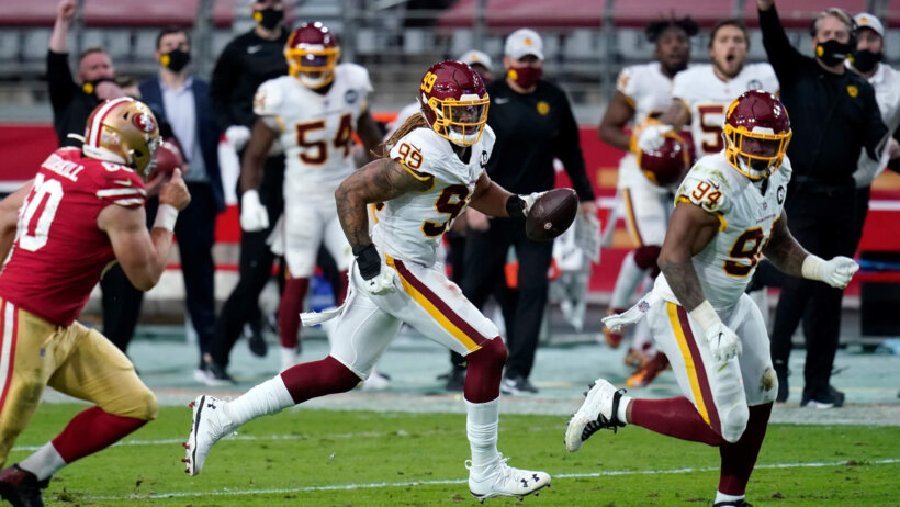 Chase Young running with football