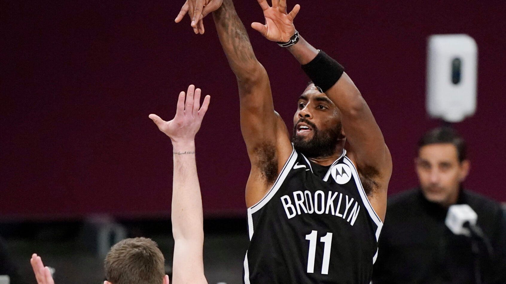 Brooklyn Nets guard Kyrie Irving shooting a jumper during a game.