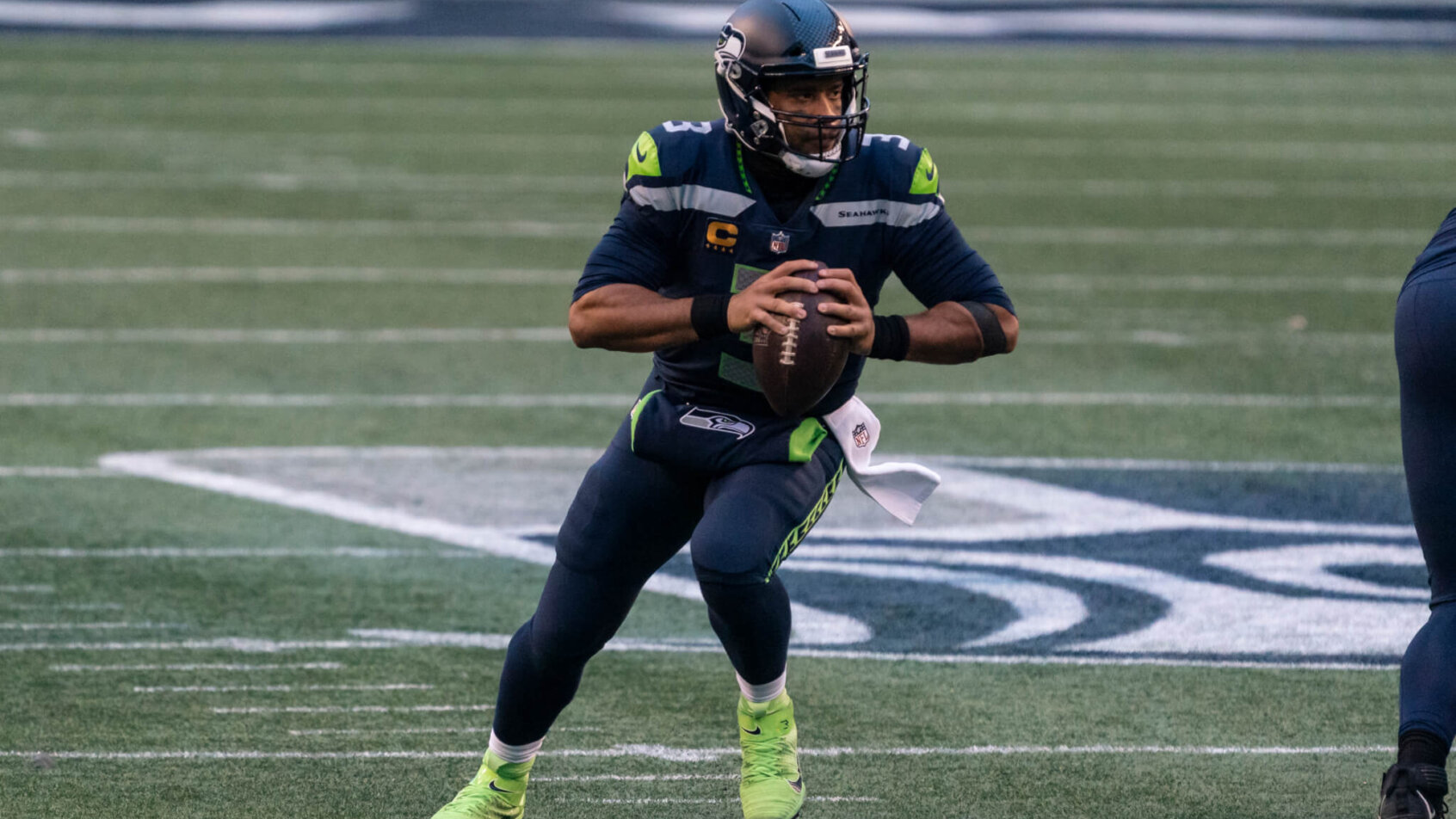 Russell Wilson dropping back to pass