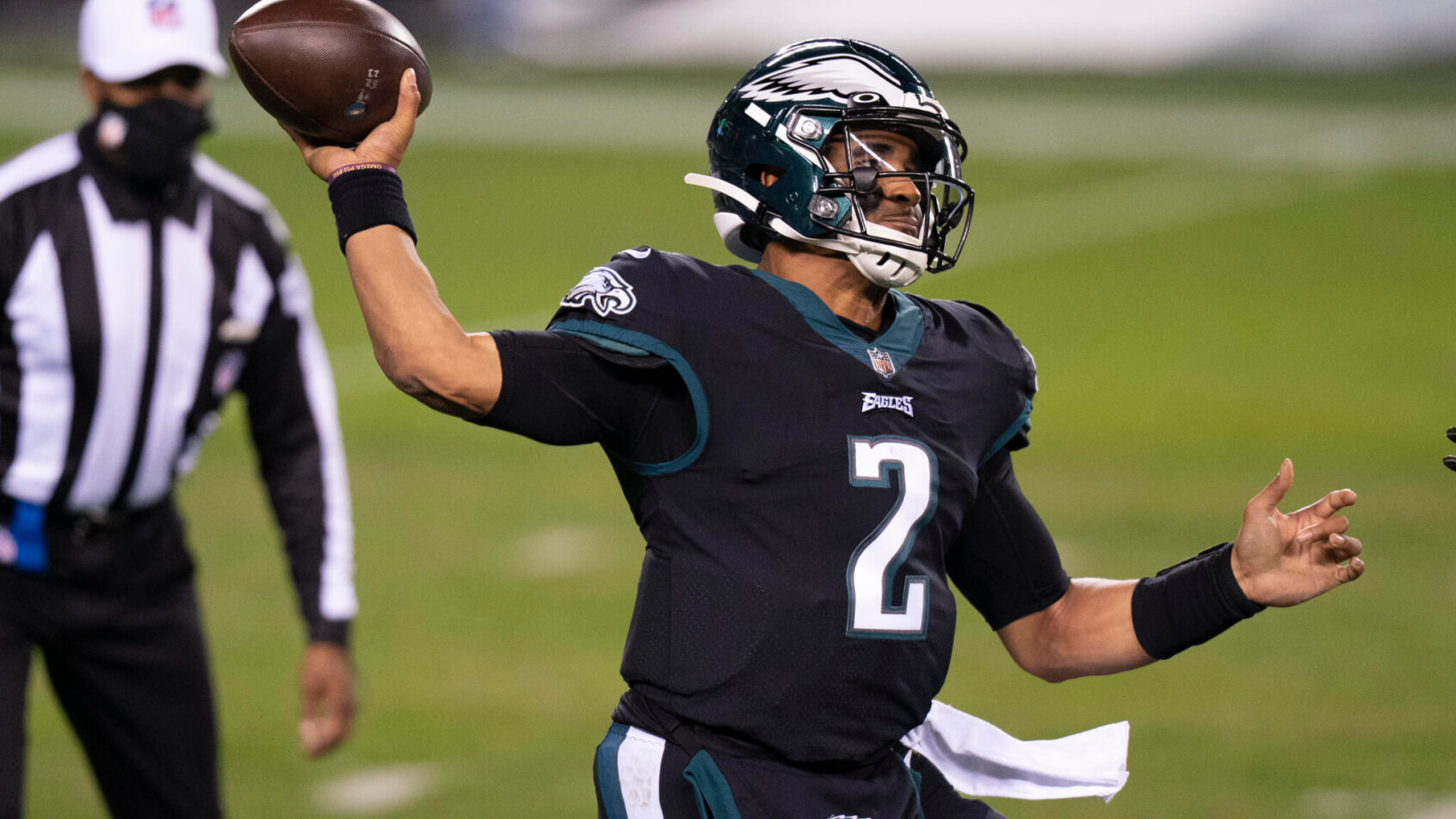 Philadelphia Eagles quarterback Jalen Hurts throwing a pass in a game.