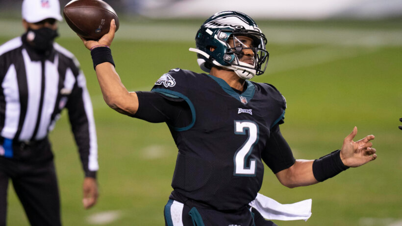 Philadelphia Eagles quarterback Jalen Hurts throwing a pass in a game.