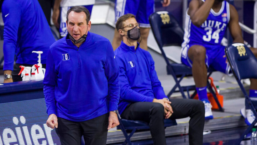 Duke head coach Mike Krzyzewski reacting to a play on the court.