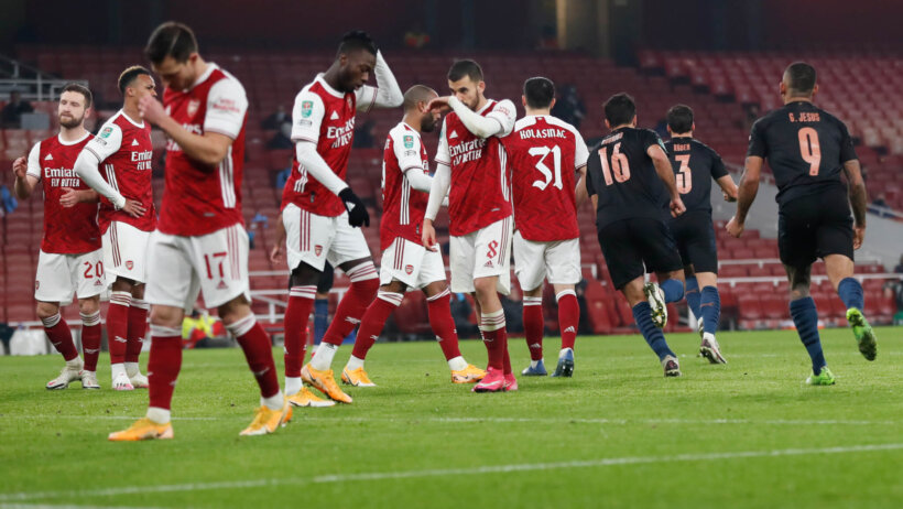 Arsenal players reacting to being scored on during a game against Manchester City