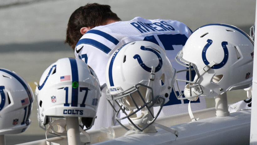 Philip Rivers on the bench with his head down