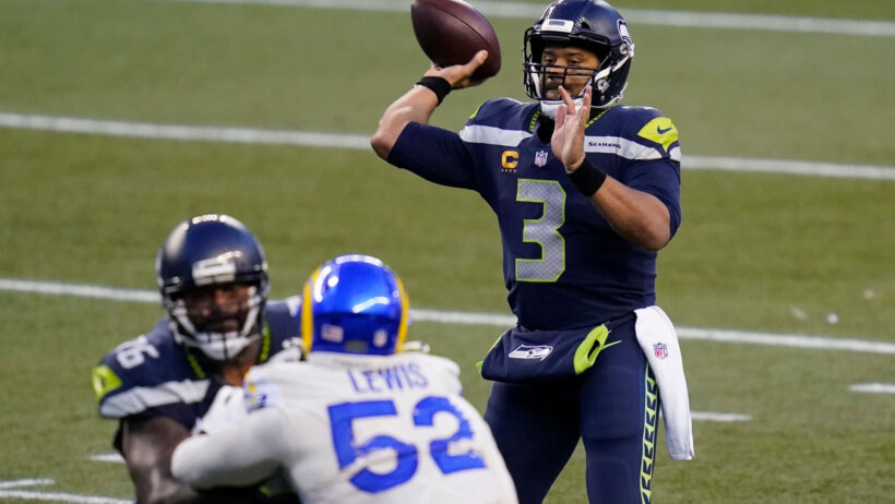 Seattle Seahawks quarterback Russell Wilson throwing a pass in a game.