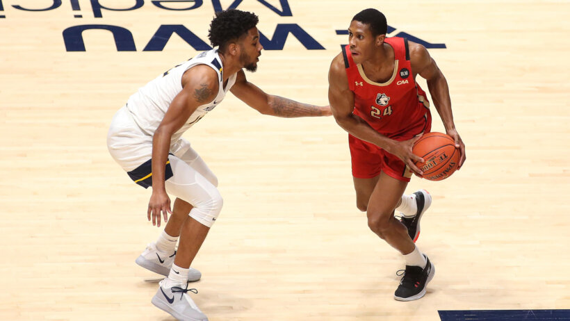 Northeastern guard Shaquille Walters being guarded by West Virginia guard Taz Sherman
