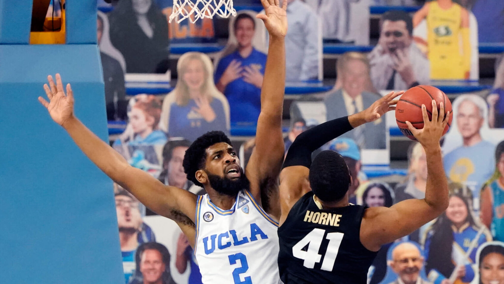 UCLA forward Cody Riley left, defending Colorado forward Jeriah Horne during a college basketball game.