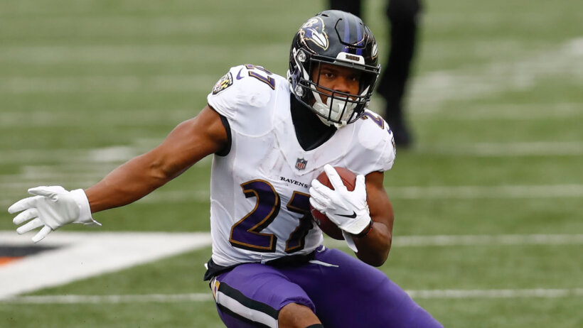 JK Dobbins of the Baltimore Ravens making a cut