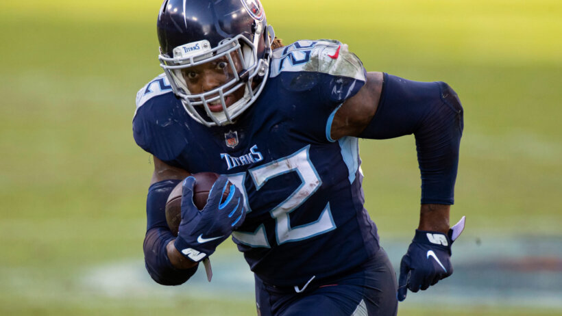 Tennessee Titans running back Derrick Henry running with the ball during a game.