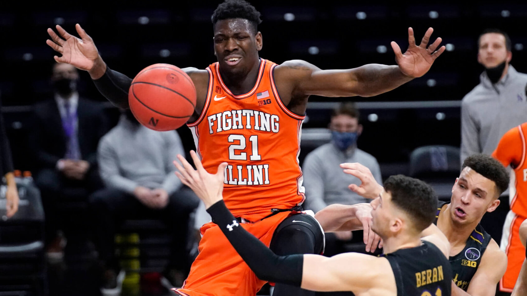 Kofi Cockburn jumping with arms out, battling for rebound