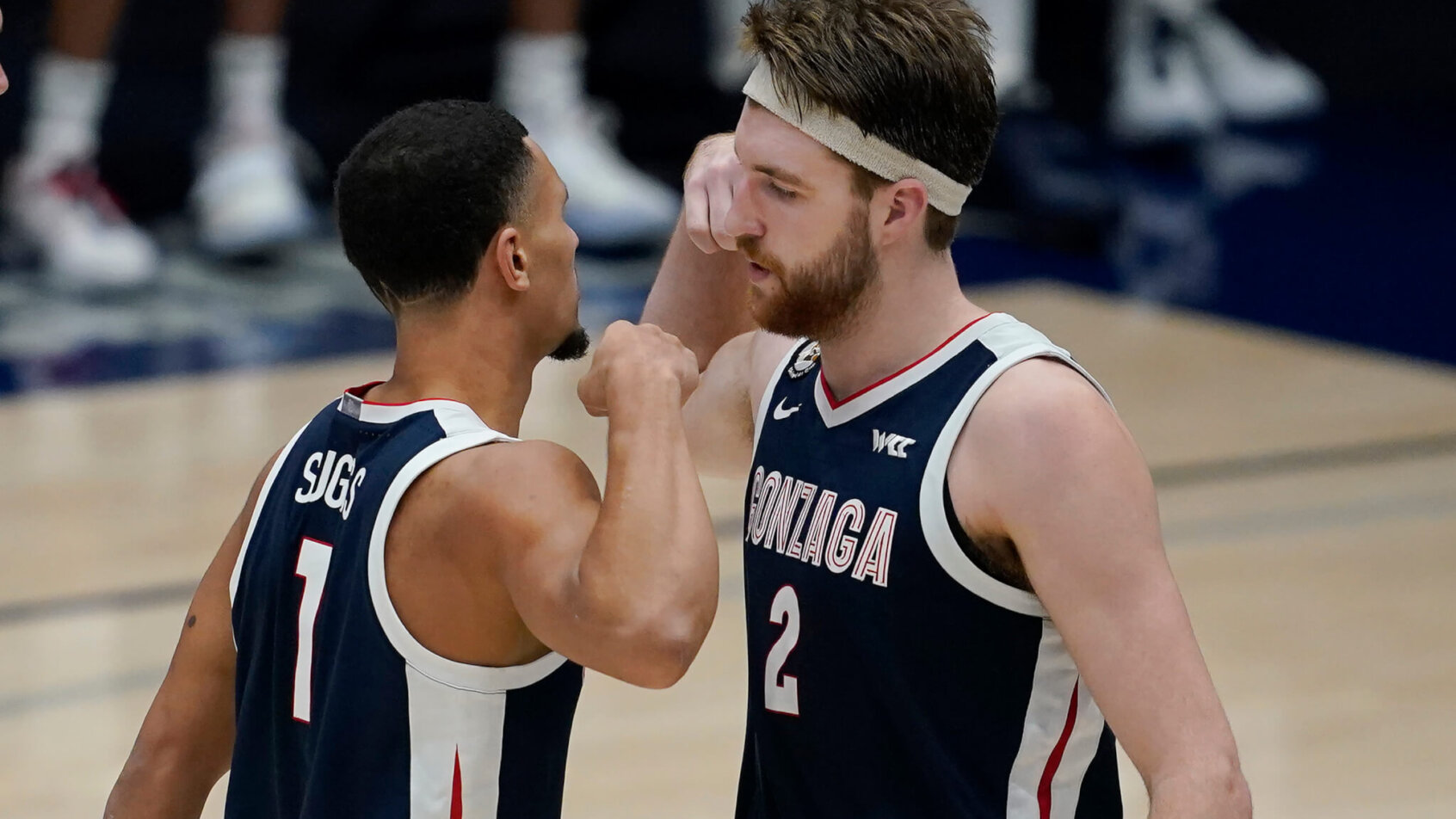 Gonzaga guard Jalen Suggs celebrating with forward Drew Timme during a college basketball game.