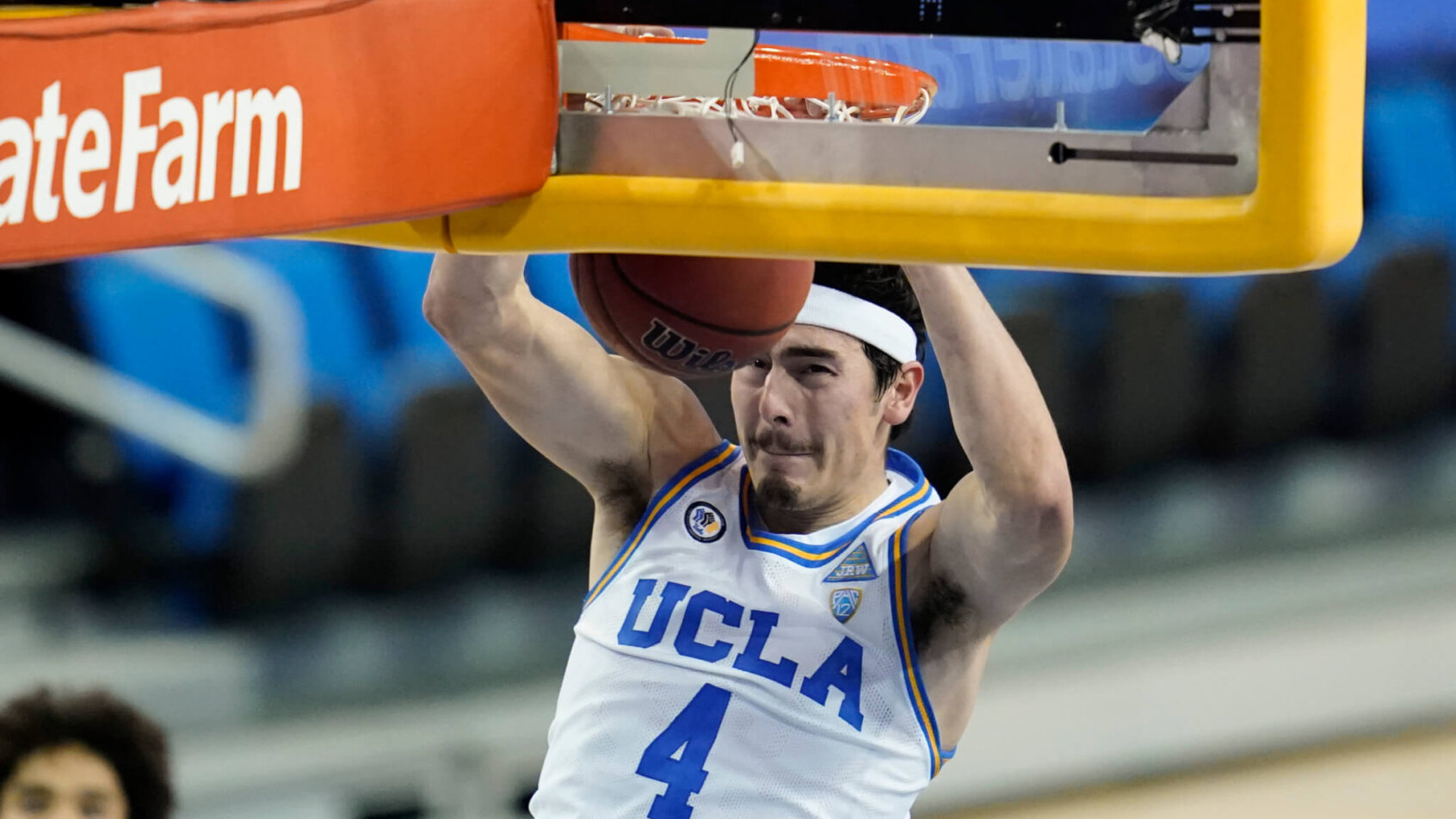 Jaime Jaquez Jr. dunks basketball