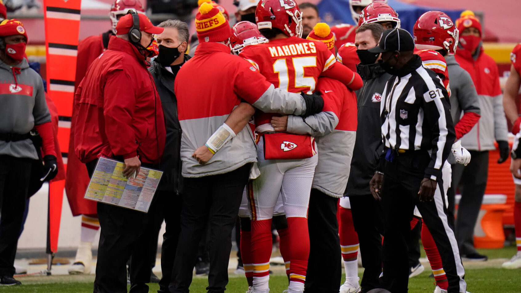 Kansas City Chiefs quarterback Patrick Mahomes is helped off the field after getting injured during the divisional round game against the Cleveland Browns.