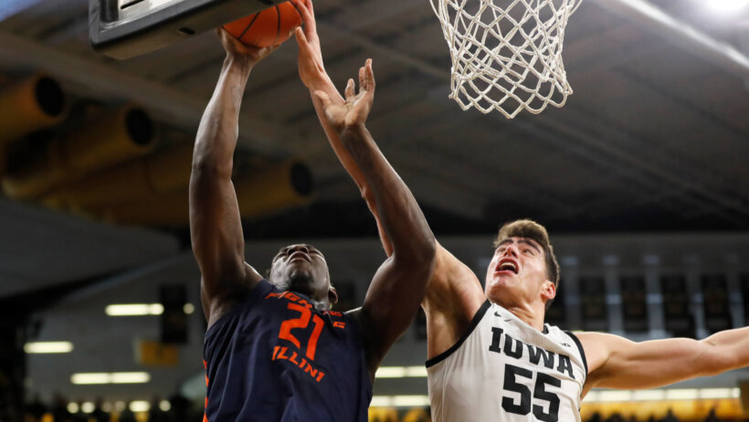 Luka Garza contesting Kofi Cockburn shot at the rim