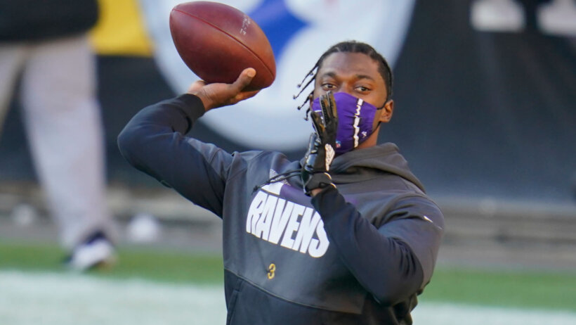 Baltimore Ravens quarterback Robert Griffin III warming up