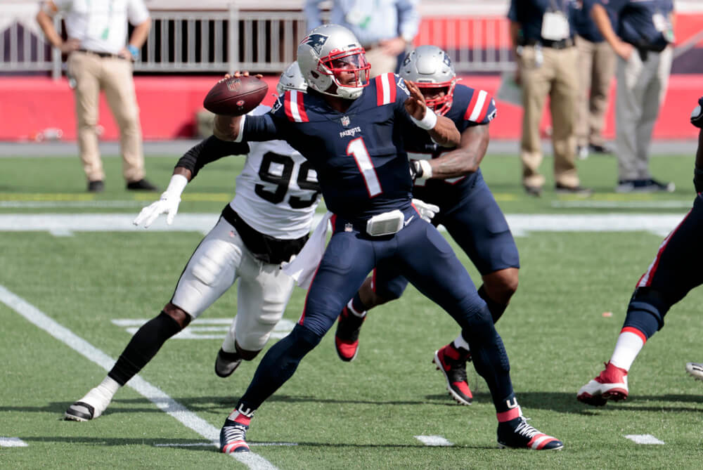 Patriots QB Cam Newton throws a pass