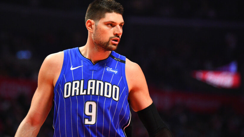 A mid shot of Orlando Magic Center Nikola Vucevic looking off to the side during a game.