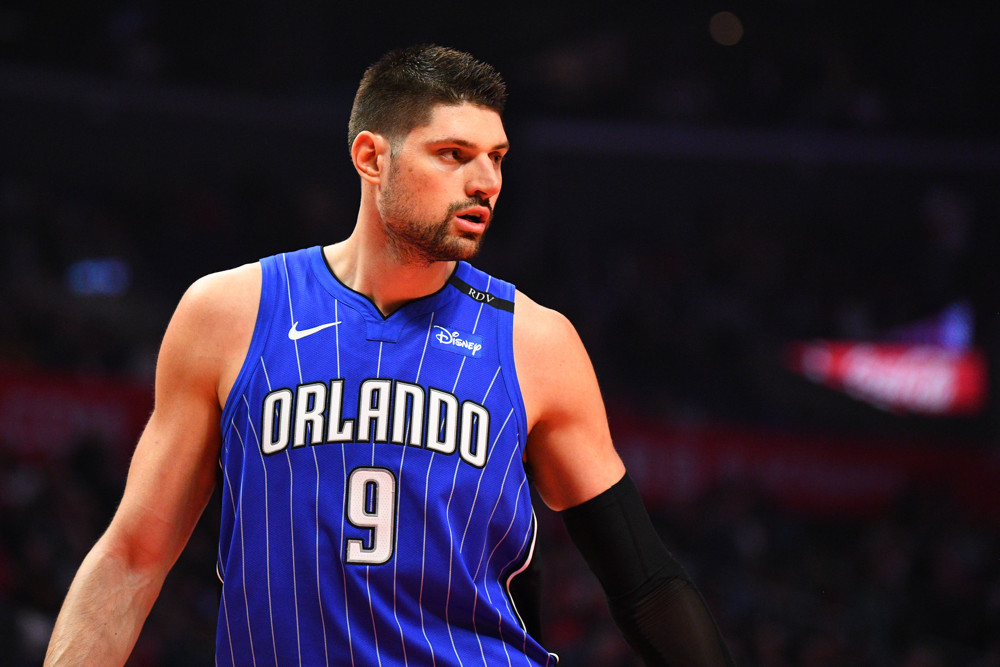 A mid shot of Orlando Magic Center Nikola Vucevic looking off to the side during a game.