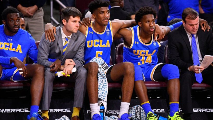 UCLA players sitting on the bench