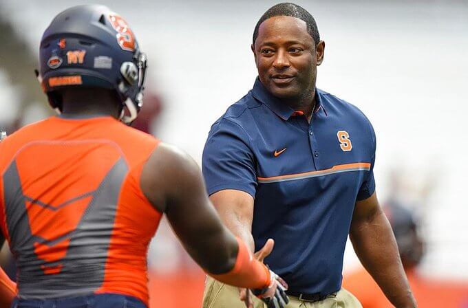 Dino Babers shaking hands with a player