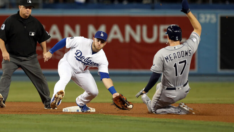 Max Muncy laying a tag on Austin Meadows at second base