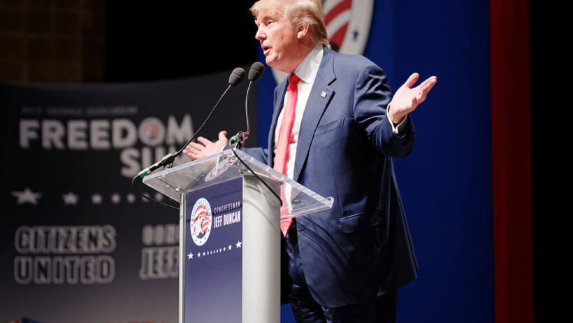 Donald Trump gesturing on stage