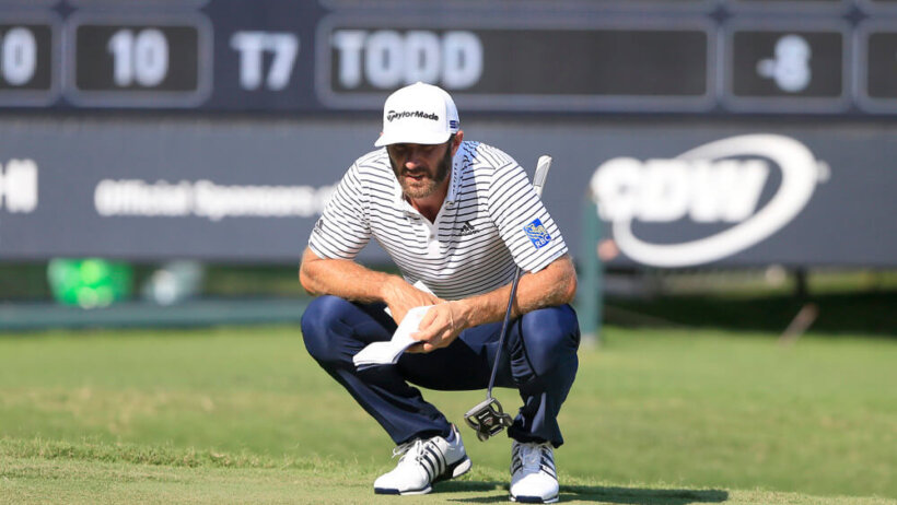Dustin Johnson crouches