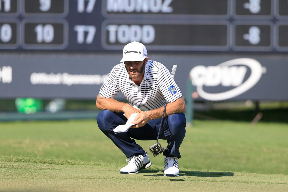 Dustin Johnson crouches