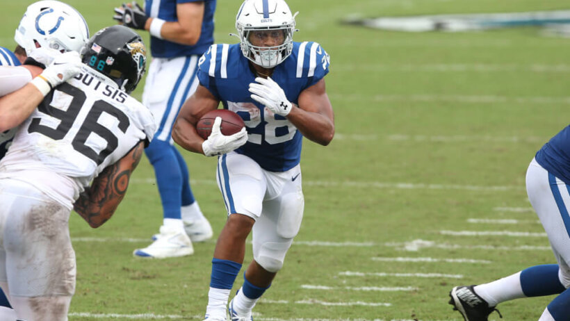 Jonathan Taylor running football