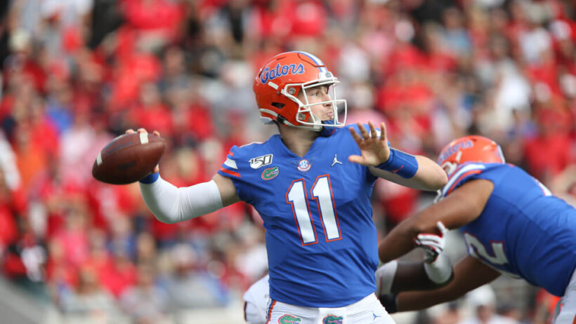Kyle Trask throwing