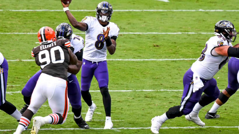 Lamar Jackson delivering pass