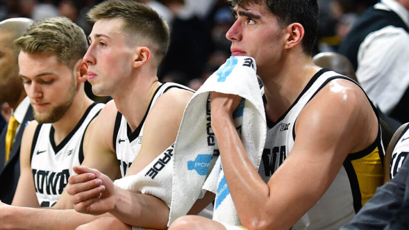 Luka Garza and teammates on the Iowa Hawkeyes bench