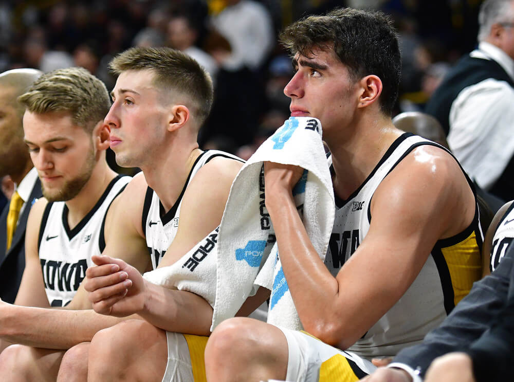 Luka Garza and teammates on the Iowa Hawkeyes bench