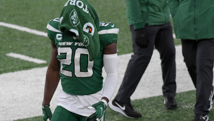 New York Jets' Marcus Maye with a towel over his head