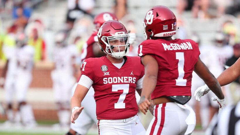 Oklahoma Sooners QB Spencer Rattler (7) celebrates with RB Seth McGowan